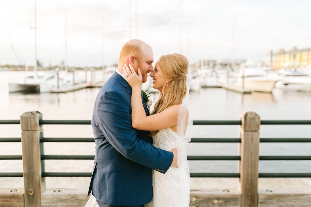person in wedding dress and suit embracing.