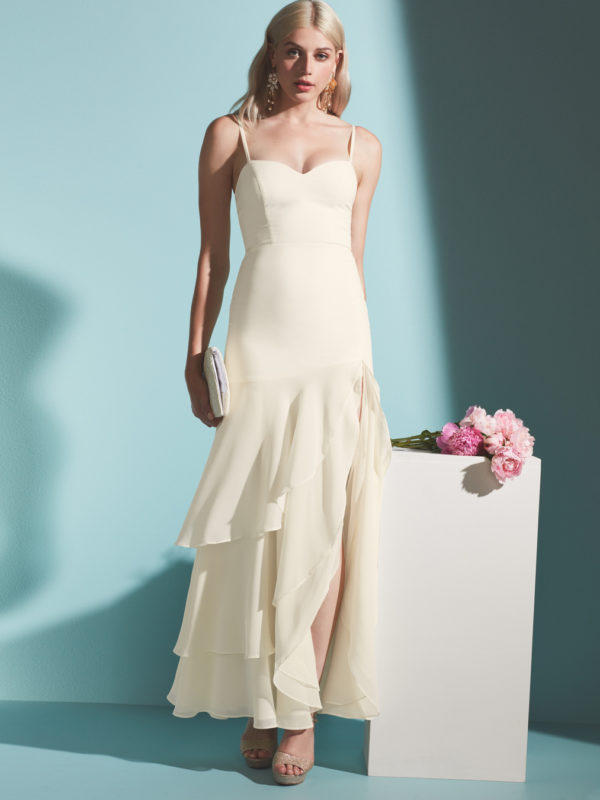 Bride in long ruffled wedding dress by Fame & Partners x David's Bridal